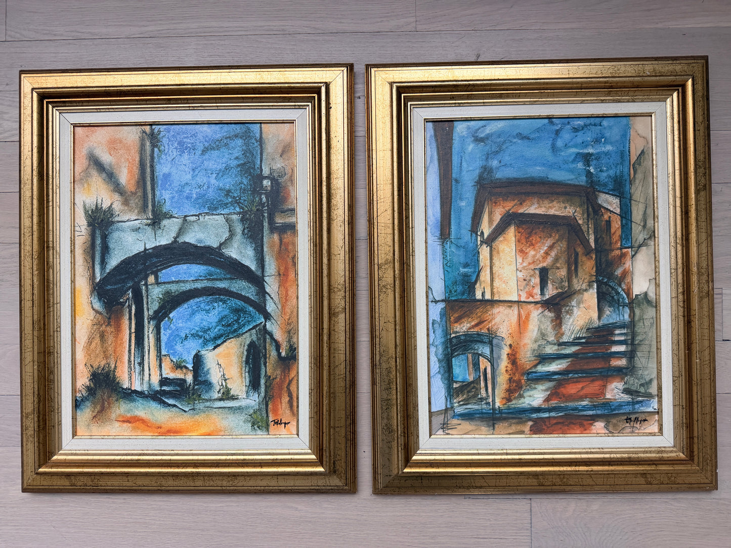 Set of two abstract oil paintings on canvas w/ gold frames.